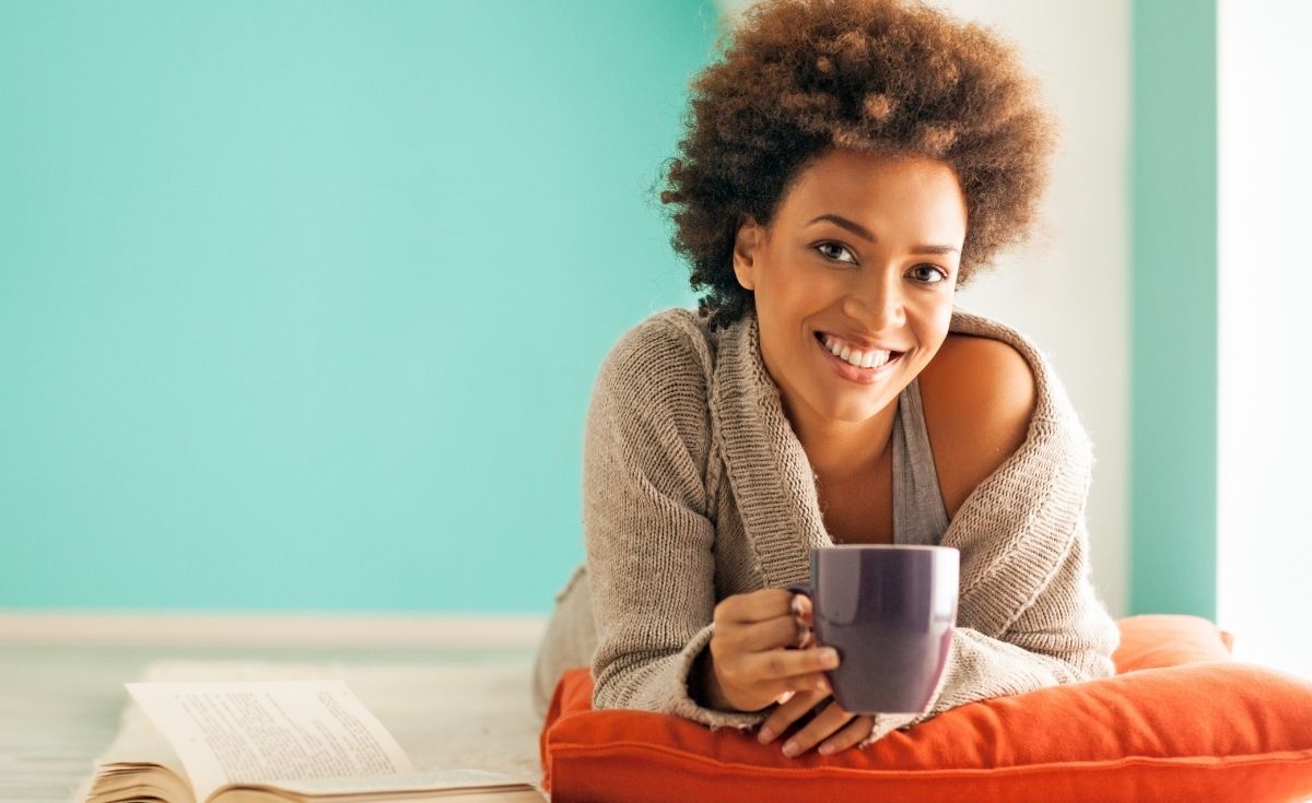 photo of a woman relaxing and enjoying a cup of tea